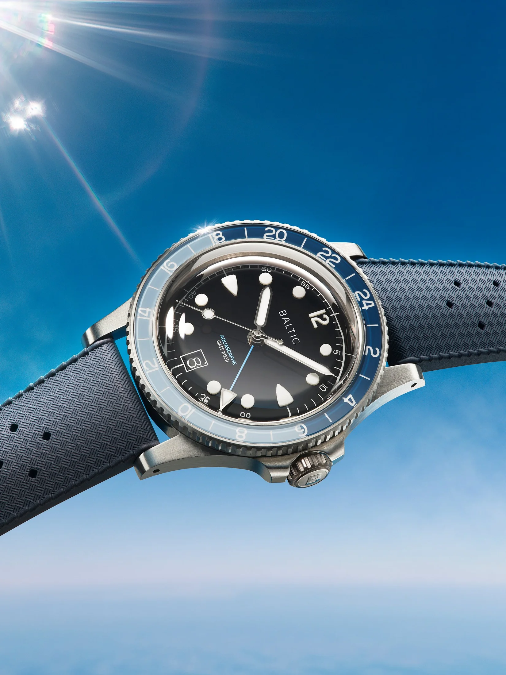 The Blue model on rubber: the crown guards and raised sapphire crystal are visible in profile. Official Baltic campaign image.