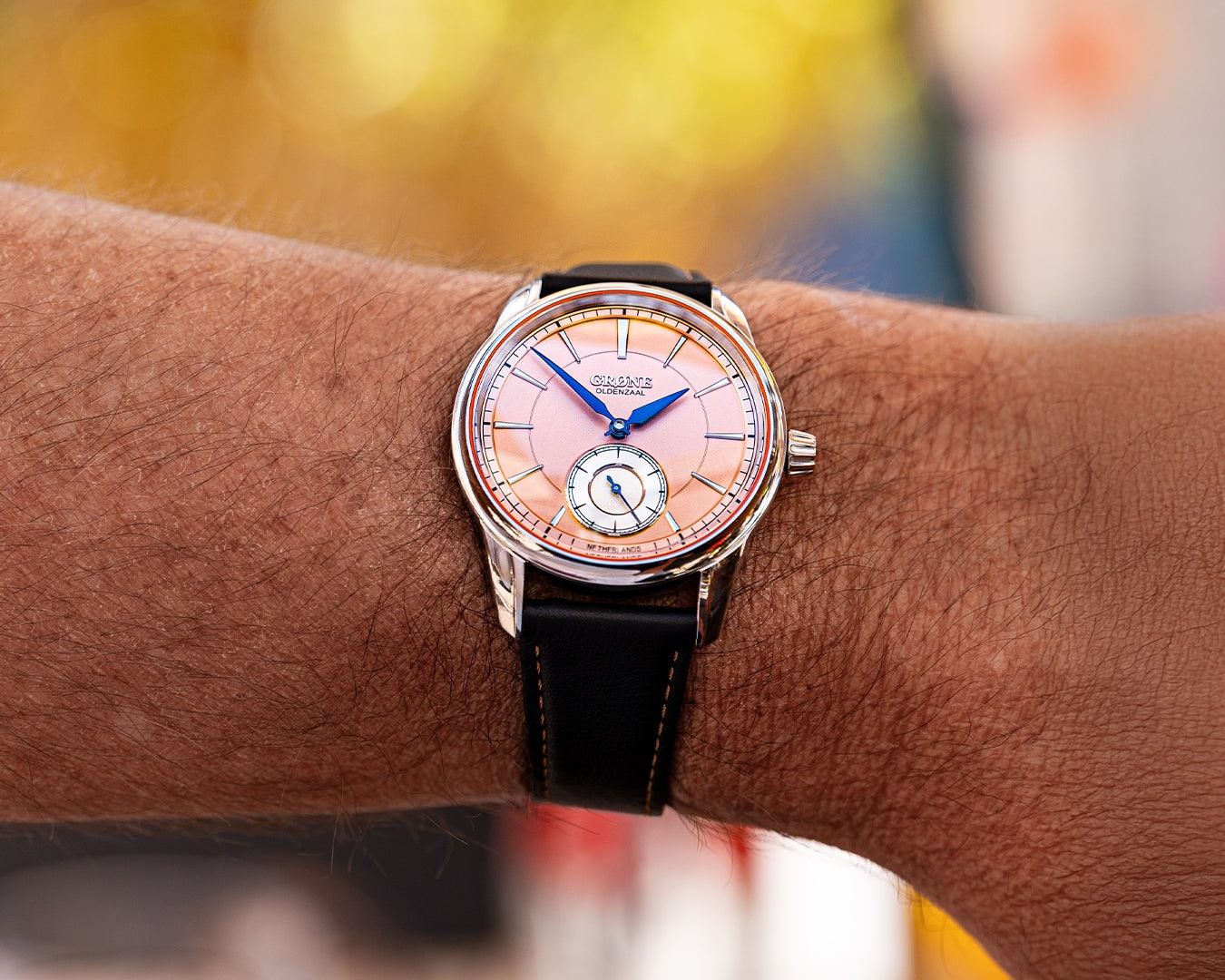 GRØNE Horologium Something Classic salmon dial worn on wrist.