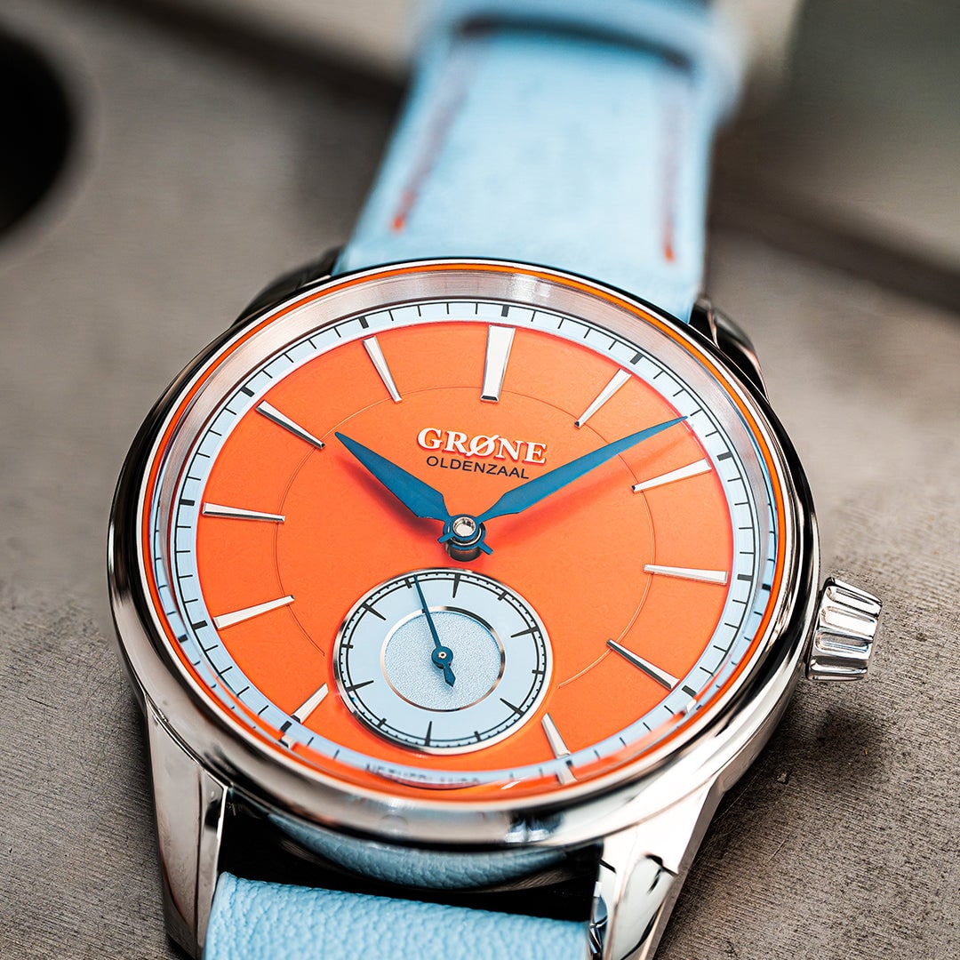 GRØNE Horologium Something Quirky front dial view with orange dial and small seconds.