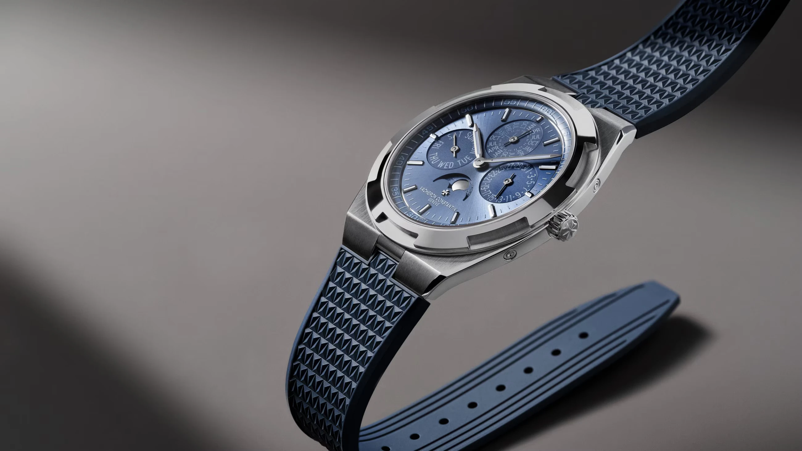Side profile of the Vacheron Constantin Overseas H119 on blue rubber.